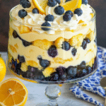 Easy Lemon Blueberry Trifle Recipe for Beginners 4 Elegant lemon blueberry trifle in a glass bowl showing beautiful layers of lemon curd, whipped cream, cake, and fresh blueberries