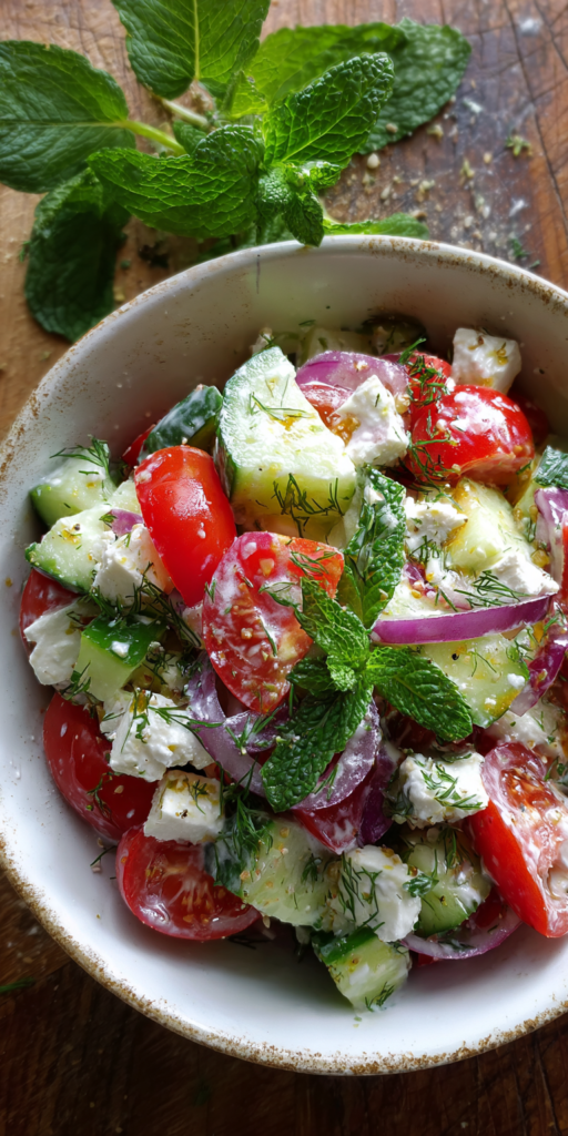 Creamy Cucumber Tomato and Feta Salad served warm with cozy spices